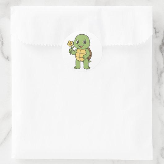 Turtle holding a flower ronde sticker (Tas)