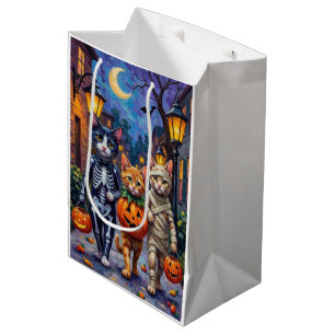 Tuxedo katten gaan langs de deuren in Halloween-ko Medium Cadeauzakje