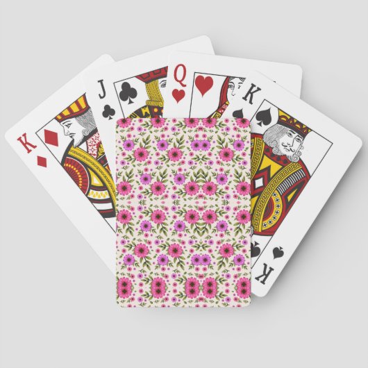 Twee afbeeldingen met speelkaarten met een bloemmo (Achterkant)