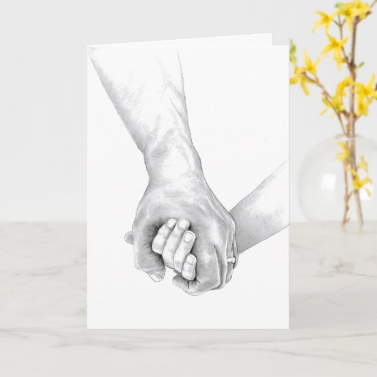 Twee armen zijn met elkaar in elkaar geslagen in t kaart (Gele Bloem)