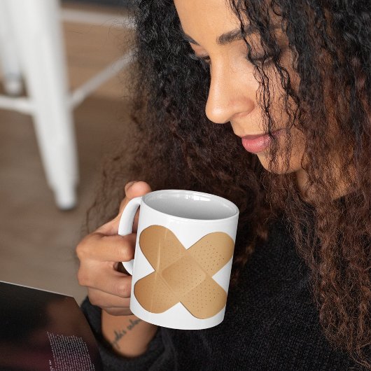 Twee bandhulpmiddelen koffiemok