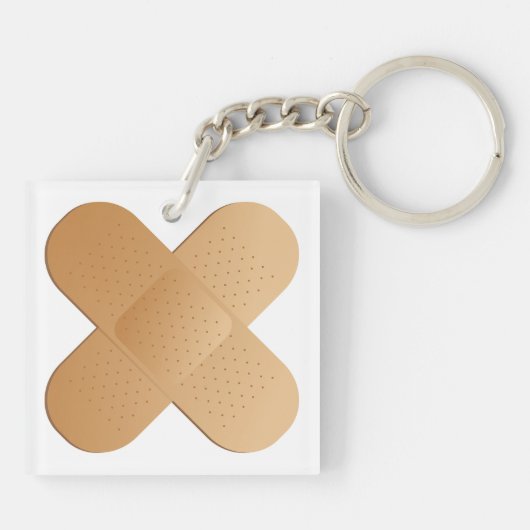 Twee bandhulpmiddelen sleutelhanger (Achterkant)