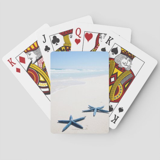 Twee blauwe zeester aan de rand van het water op t pokerkaarten (Achterkant)