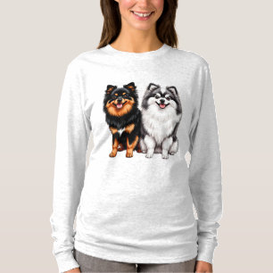 Twee blije pluizige honden zitten naast elkaar t-shirt
