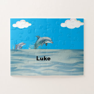 Twee dolfijnen spelen legpuzzel