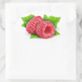 Twee frambozen met bladeren ovale sticker (Tas)