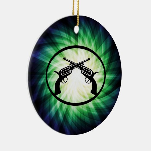 Twee gekruiste pistolen; gloeiend keramisch ornament (Rechts)