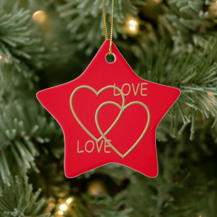 Twee gouden liefhebbende harten keramisch ornament