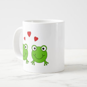Twee groene kikkers met rood hart. grote koffiekop