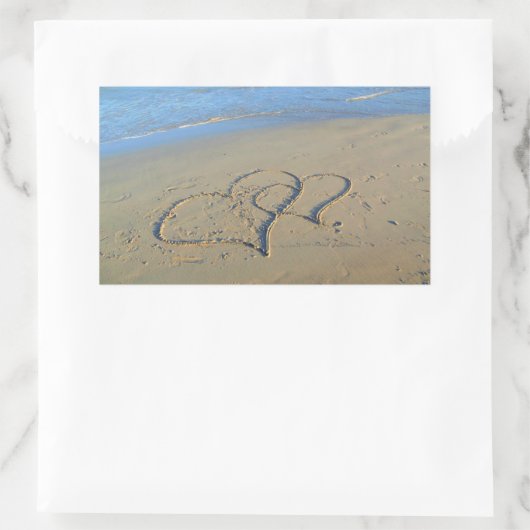 Twee harten in strandzand rechthoekige sticker (Tas)