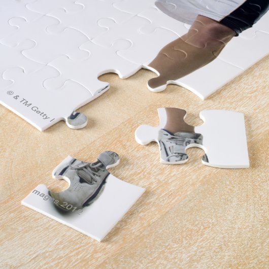 Twee jonge mannen die lacrossen spelen legpuzzel (Zijkant)