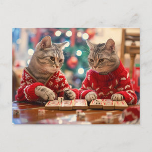 Twee katten in rode truien met een feestelijke ach feestdagenkaart