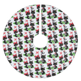 TWEE KLEINE ZWARTE KITTEN MET LINTEN IN HUN HAAR KERSTBOOM ROK