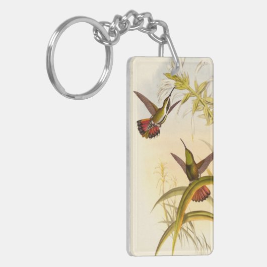Twee kleurige Hummingvogels die op dezelfde bloem  Sleutelhanger (Voorkant Links)