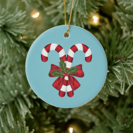 Twee rode en witte feestelijke snoepstokken op bla keramisch ornament