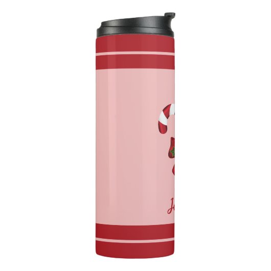 Twee rode en witte snoepjes en naam thermosbeker (Gedraaid links)