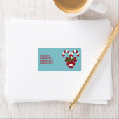 Twee rode en witte snoepjes met tekst etiket (Insitu)