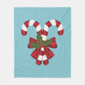 Twee rode en witte snoepjes op blauw fleece deken (Voorkant)