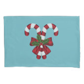 Twee rode en witte snoepjes op blauw kussensloop (Voorkant-Links)