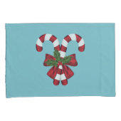 Twee rode en witte snoepjes op blauw kussensloop (Voorkant-Rechts)