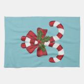 Twee rode en witte snoepjes op blauw theedoek (Horizontaal)