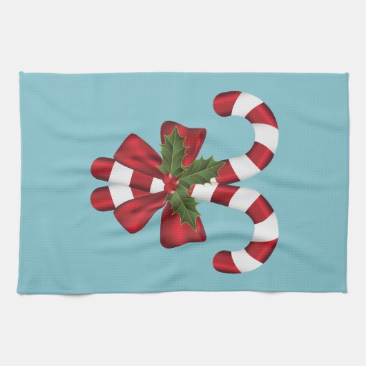 Twee rode en witte snoepjes op blauw theedoek (Horizontaal)
