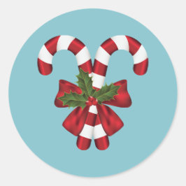 Twee rode en witte snoepstokken op blauw ronde sticker