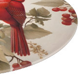 Twee rode noordelijke kardinaalvogels en bessen snijplank (Hoek)