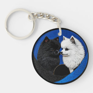 Twee schattige spitz honden sleutelhanger