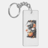 Twee schedels en een pompoen tussen de bloemen. sleutelhanger (Voorkant Links)
