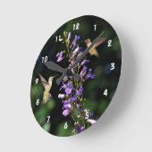 Twee trekvogels in vlucht met een drijfmuurklok ronde klok (Hoek)