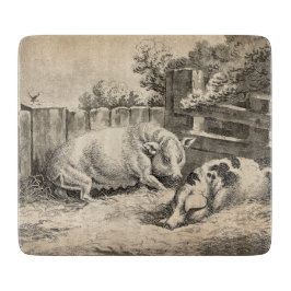 Twee Varkens die in rietje liggen in een buitenpen Snijplank