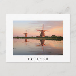 Twee windmolens met reflectie bij zonsondergang briefkaart