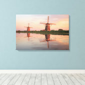 Twee windmolens met reflectie bij zonsondergang canvas afdruk (Insitu (Houten vloer))