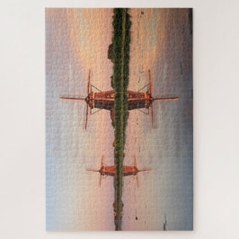 Twee windmolens met reflectie bij zonsondergang legpuzzel