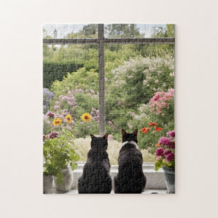 Twee zwarte katten bloemen tuin puzzel legpuzzel