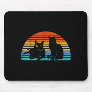Twee zwarte katten Kleurrijke achtergrond Kattenli Muismat