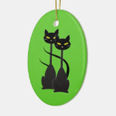 Twee zwarte katten met lange hals op groen keramisch ornament (Links)