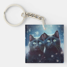 Twee zwarte katten worden besneeuwd sleutelhanger