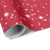 Twinkelende kerststerren op rood cadeaupapier (Rol Hoek)