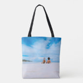 Two women lying on white sand facing beach under b tote bag (Achterkant)