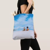 Two women lying on white sand facing beach under b tote bag (Dichtbij)