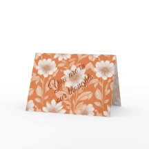 U Bent In Onze Gedachten - Witte Bloemen op Oranje