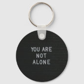 U bent niet alleen sleutelhanger (Voorkant)