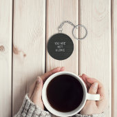 U bent niet alleen sleutelhanger