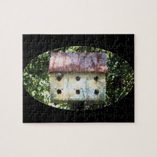 Uitgegeven vogelhuis legpuzzel