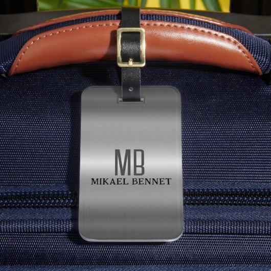 Uitvoerende stijl van een muurmonogram - zilvermet bagagelabel (Voorkant Insitu 2)