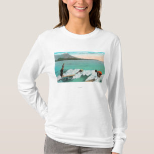 Uitzicht van de Surfers Board Riding, één die ee T-shirt