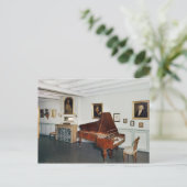 Uitzicht van een kamer met een grote piano briefkaart (Staand voorkant)