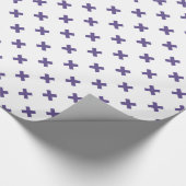 Ultra-violetkruisstiften op wit cadeaupapier (Hoek)